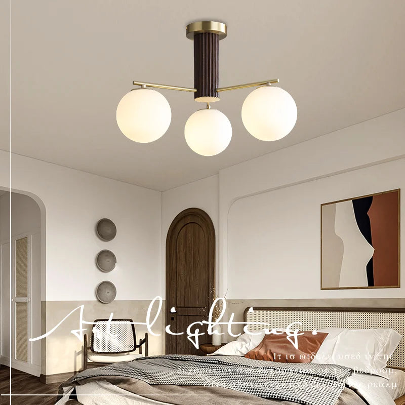 Fontaine Collection | Geometric Stone-Top Rose Quartz Chandelier - showcasing full sculptural form and curated finish in a Mid-Century Modern living room setting.