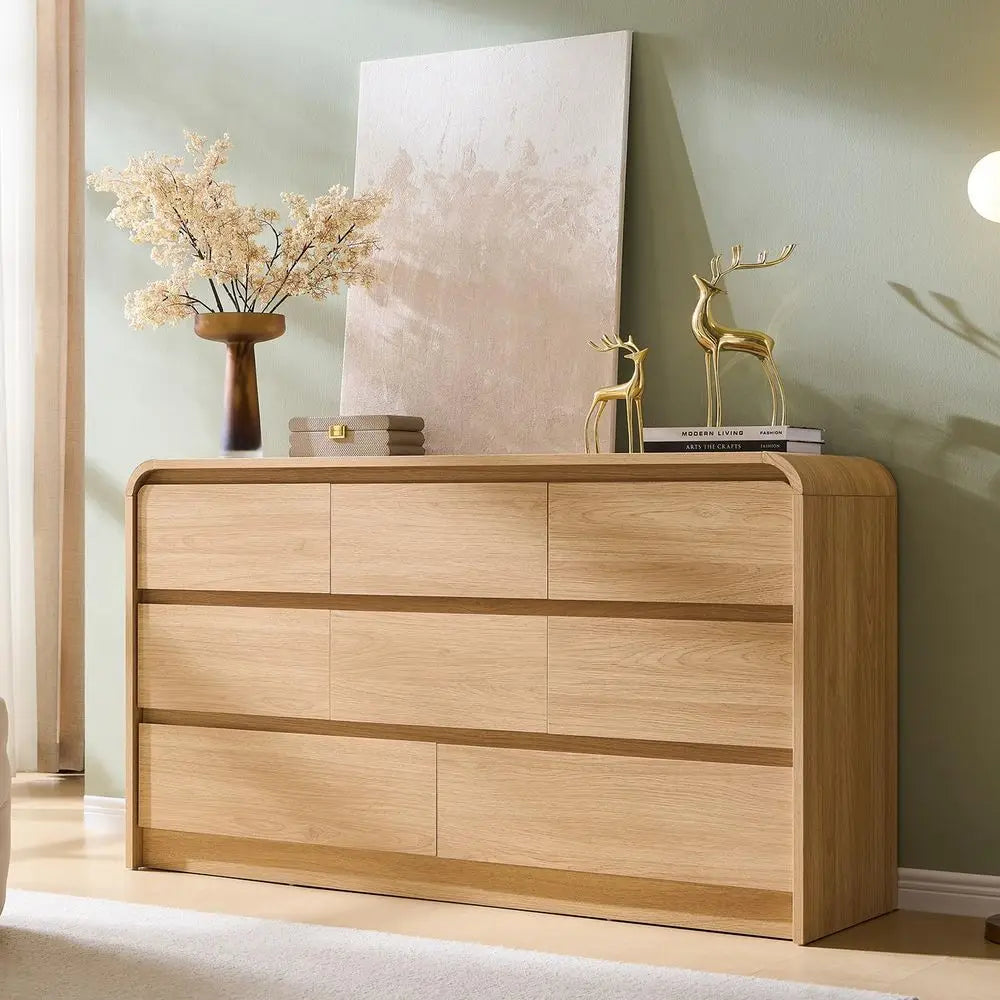 Dresden Collection | Sculptural Curved Curved Oak Dresser - revealing tonal warmth and surface patina under ambient light in a Mid-Century Modern bedroom setting.