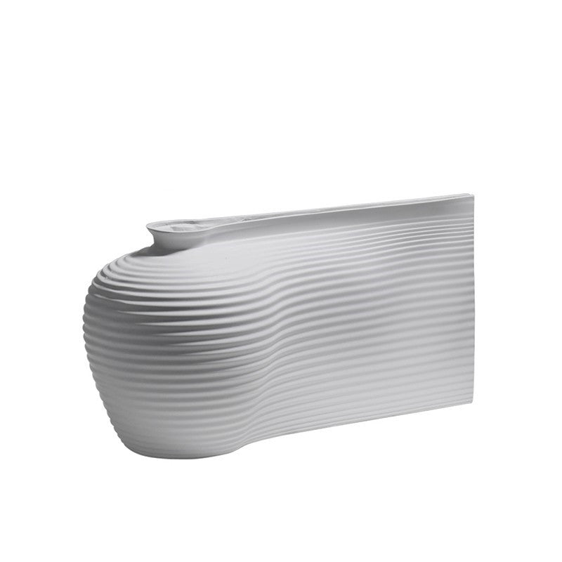 Fontaine Collection | Splayed-Leg Nordic Ceramic Vessel - showcasing full sculptural form and curated finish in a Mid-Century Modern living room setting.