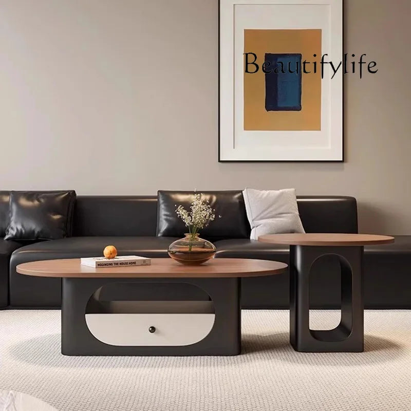 Belmont Collection | Floating Brass-Accented Walnut & Brass Oval Coffee Table - captured in a curated lifestyle vignette in a Mid-Century Modern living room setting.
