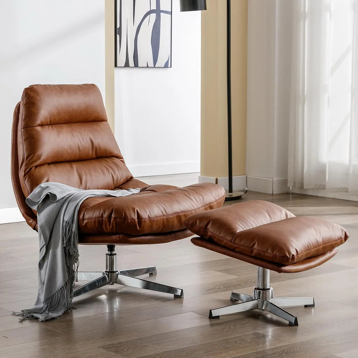 Ellington Collection | Floating Leather-Wrapped Walnut Swivel Chair and Ottoman - presented at scale within a designed interior in a Mid-Century Modern living room setting.
