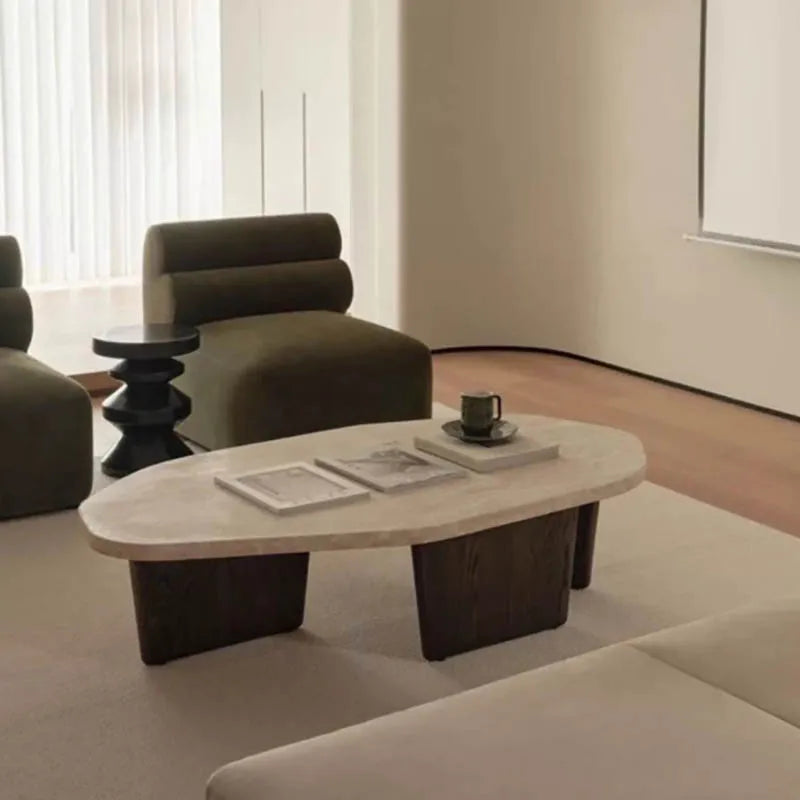 Meridian Collection | Tapered-Leg Oval Walnut Oval Coffee Table - revealing tonal warmth and surface patina under ambient light in a Mid-Century Modern living room setting.