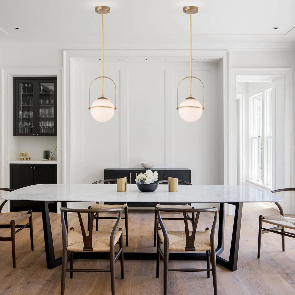 Fontaine Collection | Floating Glass-Topped Frosted Gold Glass Pendant - revealing tonal warmth and surface patina under ambient light in a Mid-Century Modern living room setting.