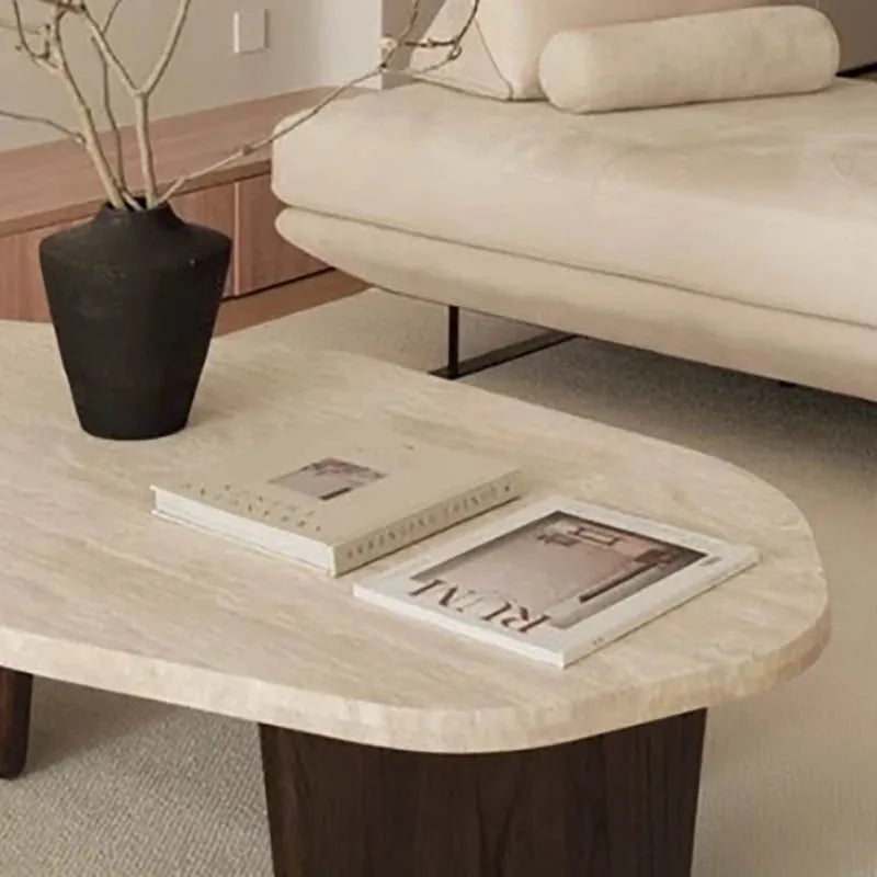 Meridian Collection | Tapered-Leg Oval Walnut Oval Coffee Table - captured in a curated lifestyle vignette in a Mid-Century Modern living room setting.