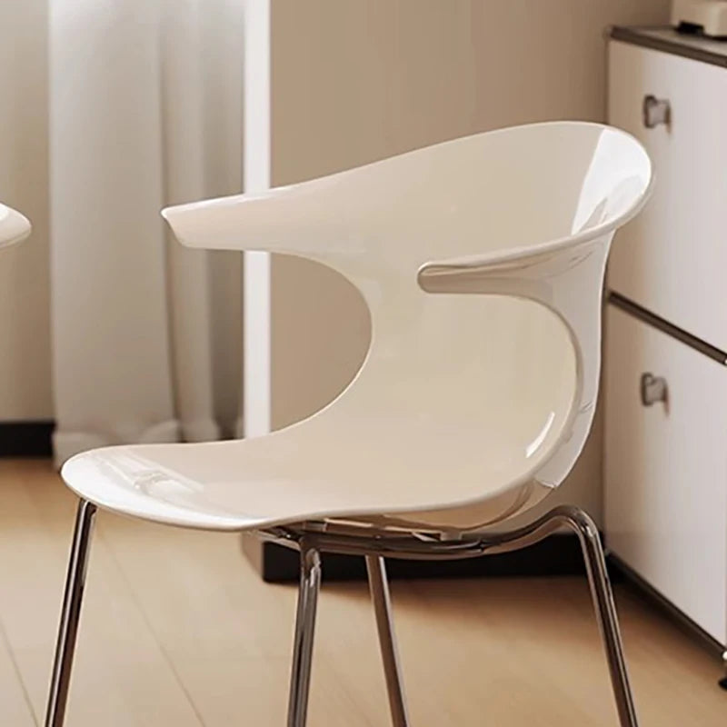 Dresden Collection | Sculptural Atomic-Era Walnut Dining Chairs - highlighting material texture and craftsmanship detail in a Mid-Century Modern dining room setting.