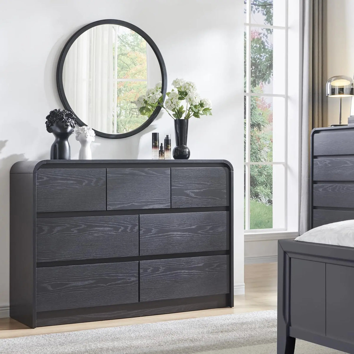 Valencia Collection | Sculptural Curved Curved Walnut Dresser - revealing tonal warmth and surface patina under ambient light in a Mid-Century Modern bedroom setting.