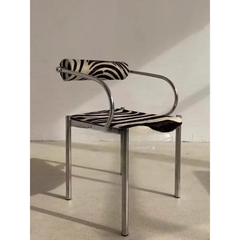 Dresden Collection | Sculptural Chrome-Detailed Zebra Hide Dining Chair - showcasing full sculptural form and curated finish in a Mid-Century Modern dining room setting.