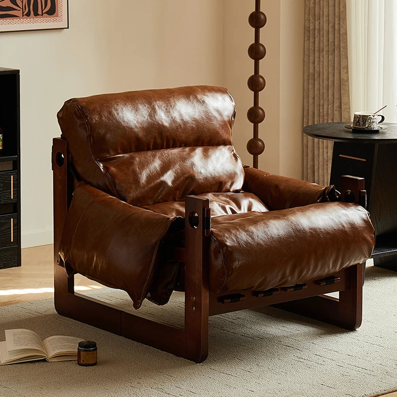 Ellington Collection | Glass-Topped Atomic-Era Cognac Leather Lounge - revealing tonal warmth and surface patina under ambient light in a Mid-Century Modern living room setting.