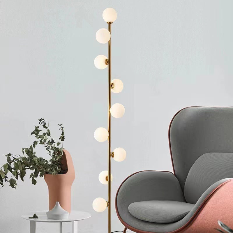 Astoria Collection | Geometric Brass-Accented Walnut & Brass Floor Lamp - showcasing full sculptural form and curated finish in a Mid-Century Modern living room setting.