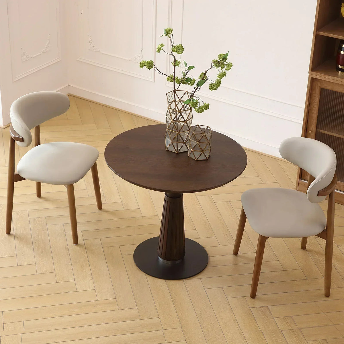Astoria Collection | Round Walnut & Brass Dining Table - showcasing full sculptural form and curated finish in a Mid-Century Modern dining room setting.