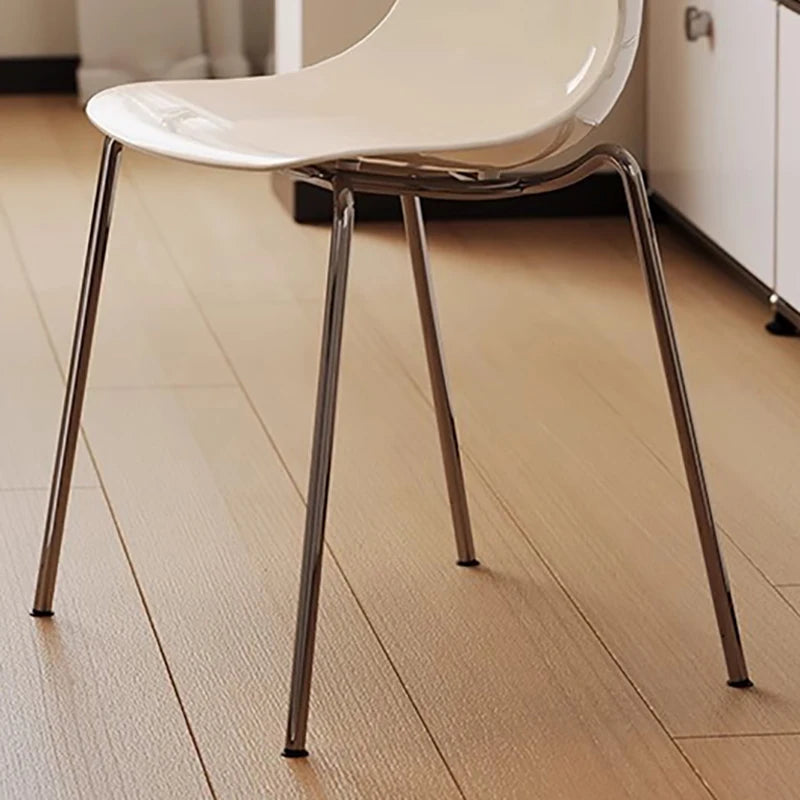 Dresden Collection | Sculptural Atomic-Era Walnut Dining Chairs - styled from an alternate angle revealing dimensional depth in a Mid-Century Modern dining room setting.