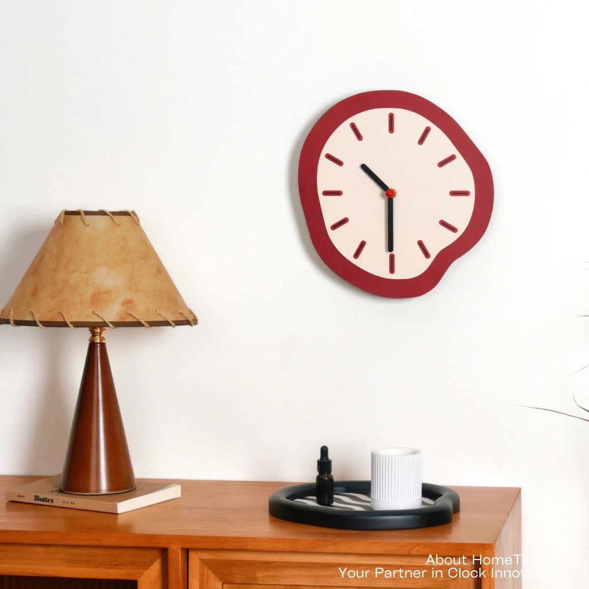 Astoria Collection | Sculptural Brass-Accented Walnut Wall Clock - presented at scale within a designed interior in a Mid-Century Modern living room setting.