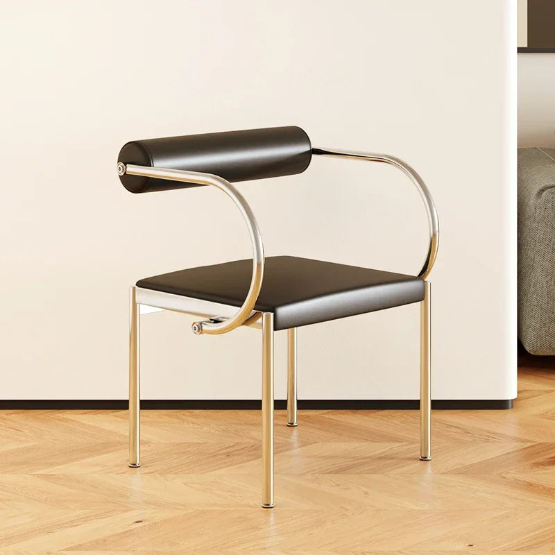Fontaine Collection | Arched Steel-Framed Brushed Steel Dining Chair - featuring close-up joinery and artisanal finish quality in a Mid-Century Modern dining room setting.