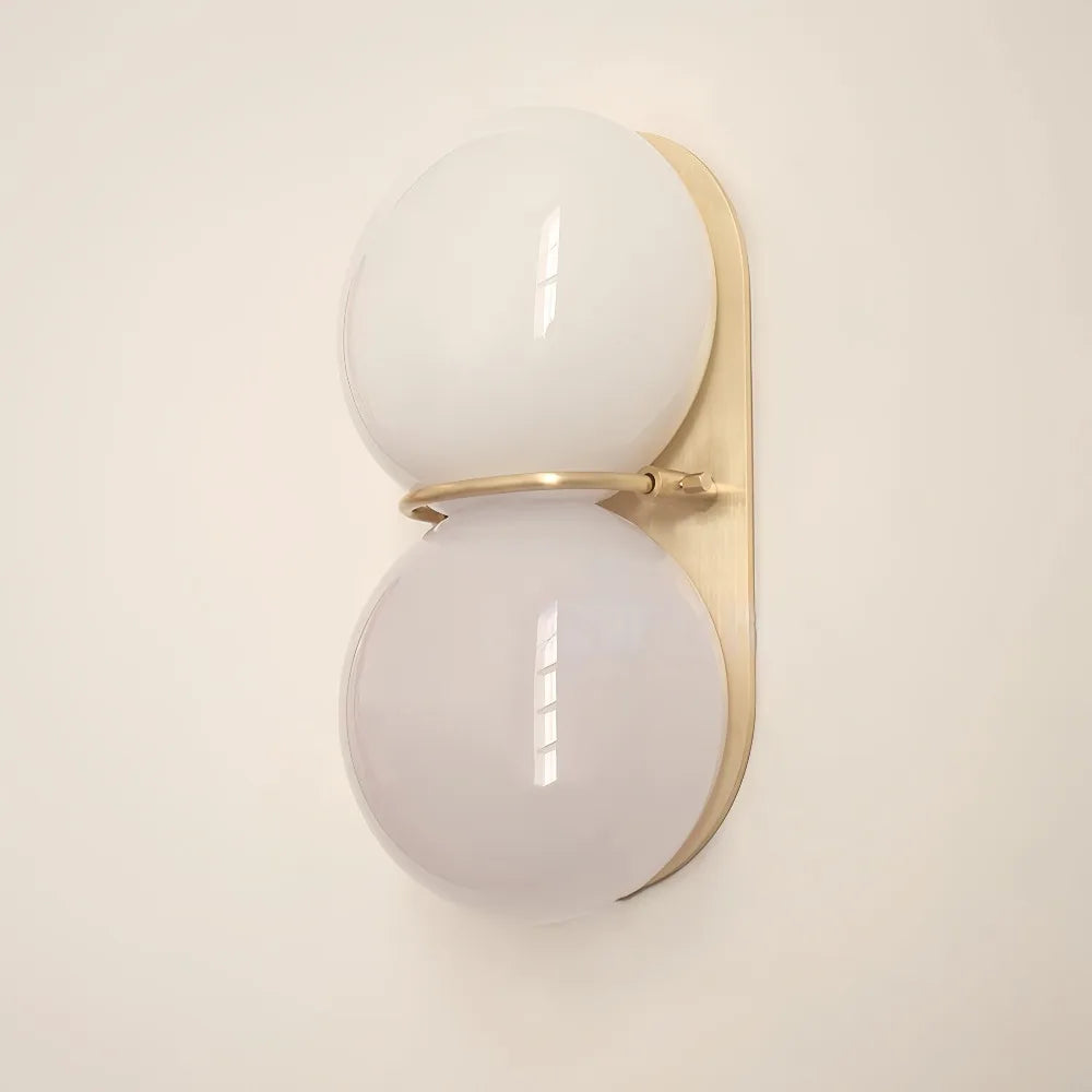 Belmont Collection | Angular Steel-Framed French Cream Sconce - framed in an editorial still-life composition in a Mid-Century Modern living room setting.