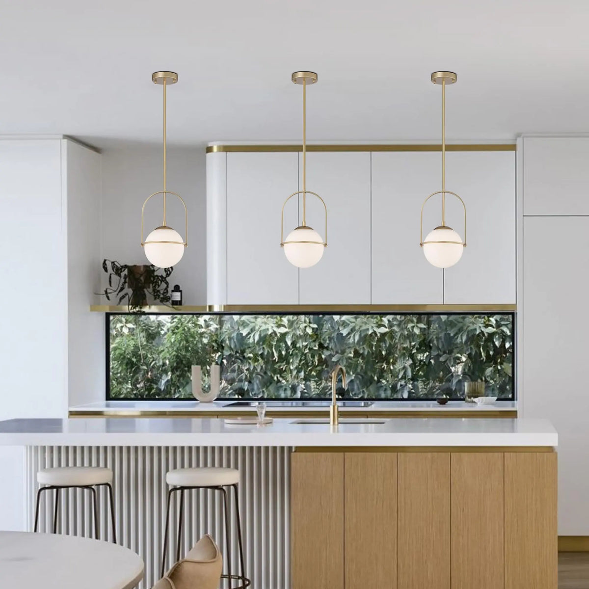 Fontaine Collection | Floating Glass-Topped Frosted Gold Glass Pendant - presented at scale within a designed interior in a Mid-Century Modern living room setting.