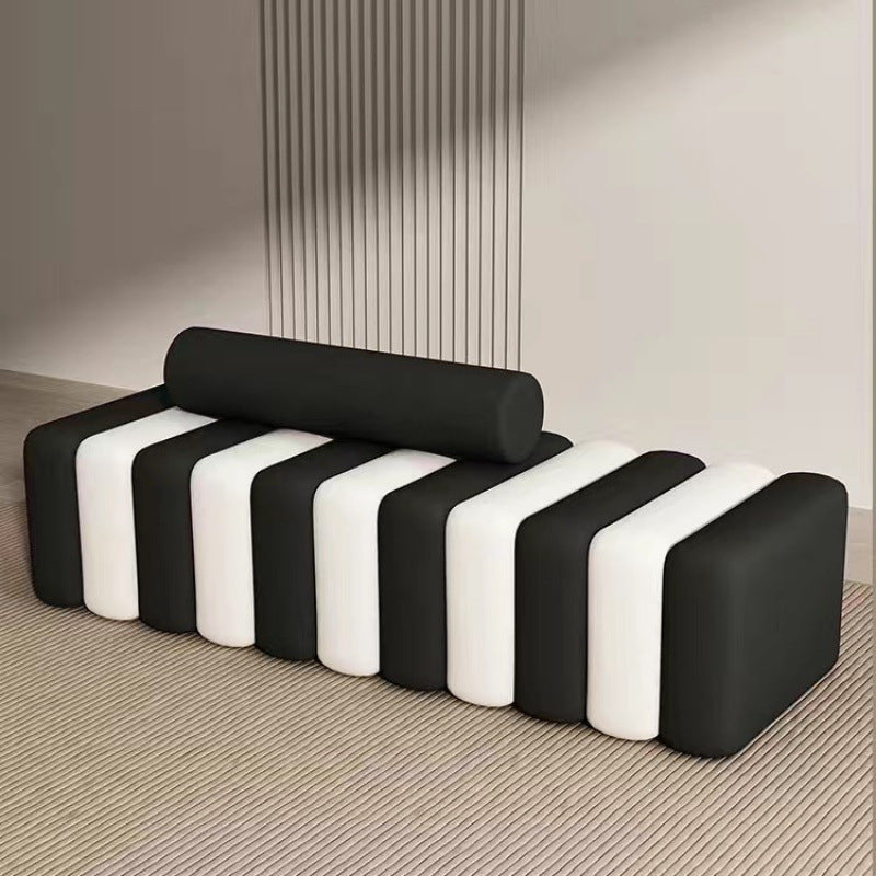 Ellington Collection | Tapered-Leg Brass-Accented Walnut Storage Bench - presented at scale within a designed interior in a Mid-Century Modern living room setting.