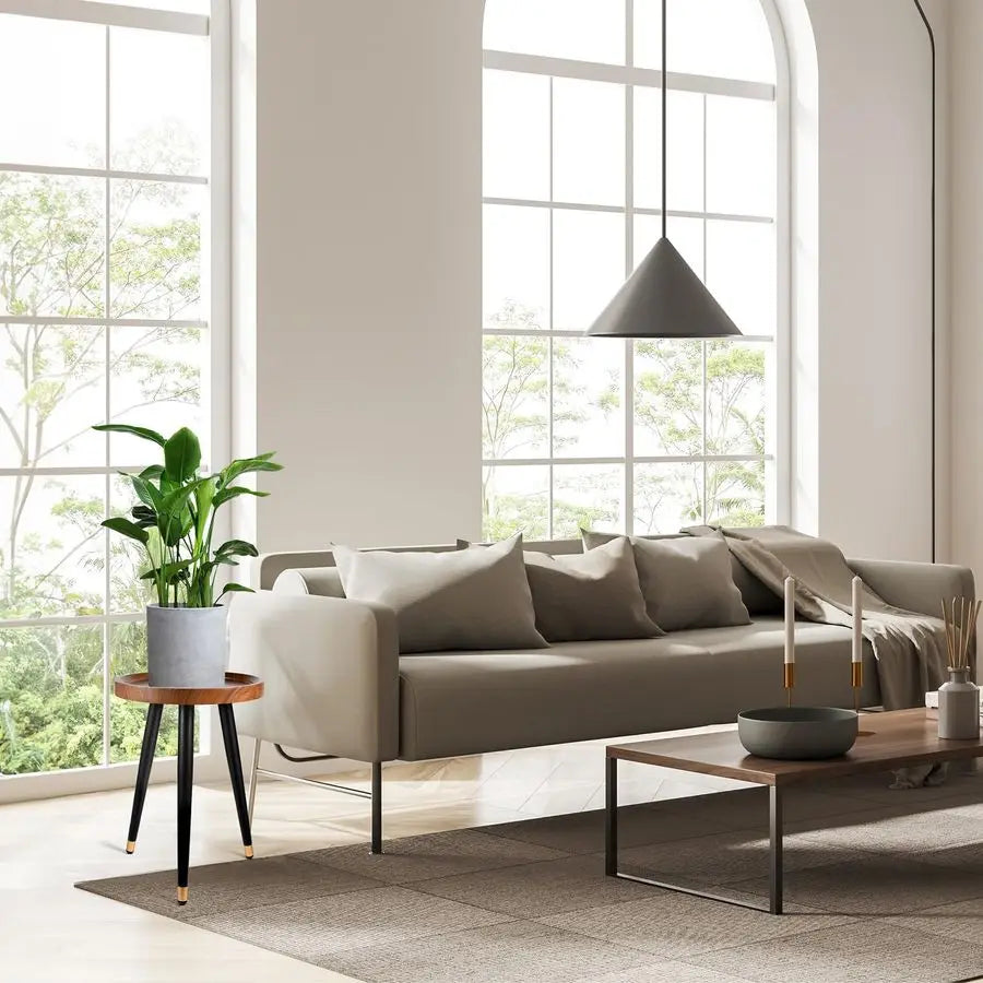 Fontaine Collection | Tapered-Leg Round Walnut Plant Stand - highlighting material texture and craftsmanship detail in a Mid-Century Modern living room setting.