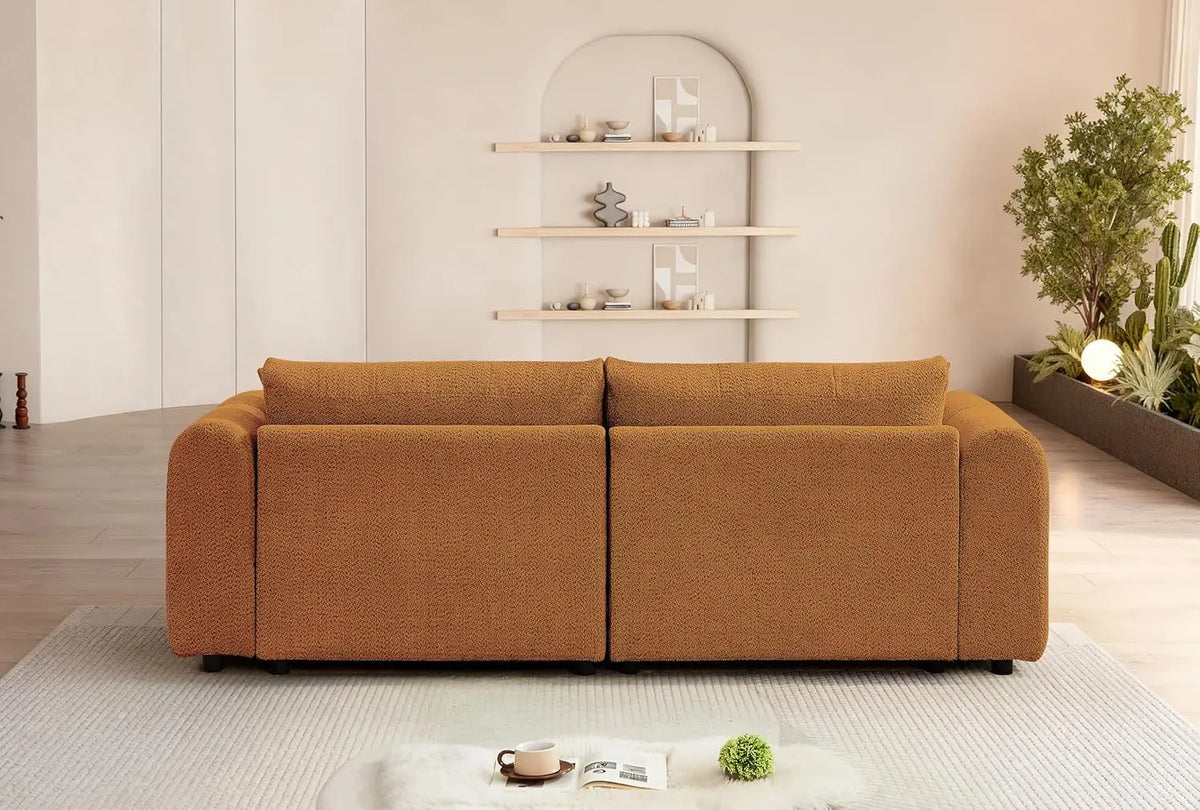 Fontaine Collection | Sculptural Atomic-Era Boucle Sofa - presented at scale within a designed interior in a Mid-Century Modern living room setting.