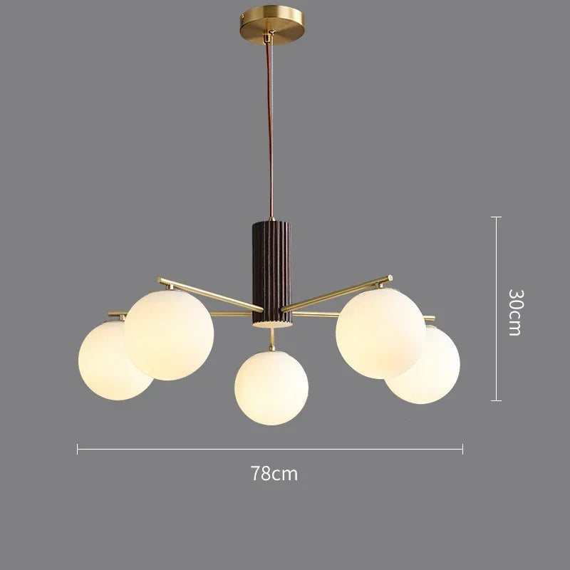 Fontaine Collection | Geometric Stone-Top Rose Quartz Chandelier - exhibiting shadow play and geometric silhouette detail in a Mid-Century Modern living room setting.