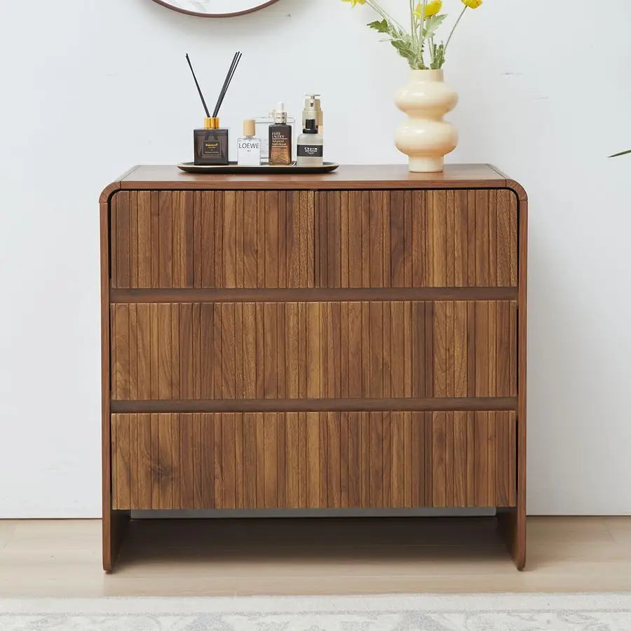 Fontaine Collection | Sculptural Brass-Accented Walnut 3-Drawer Dresser - styled from an alternate angle revealing dimensional depth in a Mid-Century Modern bedroom setting.
