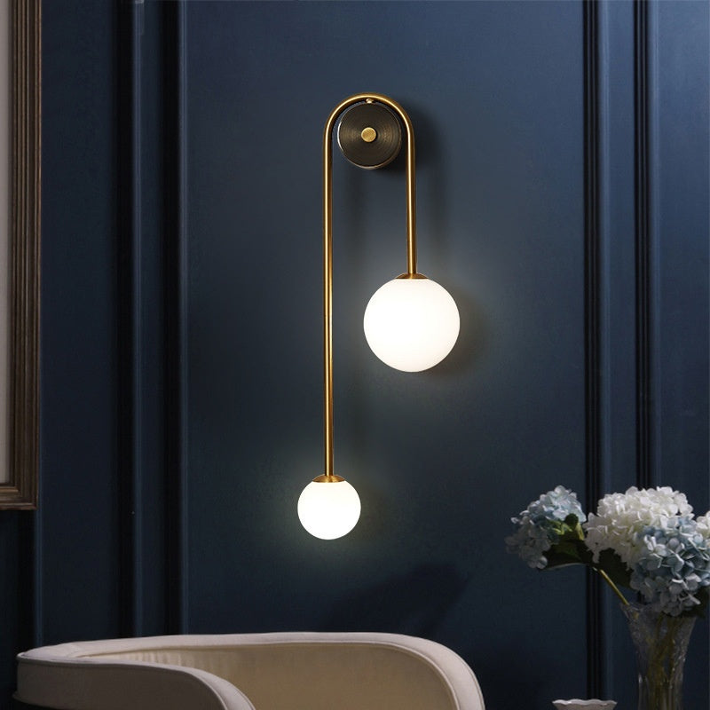 Ellington Collection | Geometric Brass-Accented Brass Sconce - showcasing full sculptural form and material finish in a Mid-Century Modern living room setting.