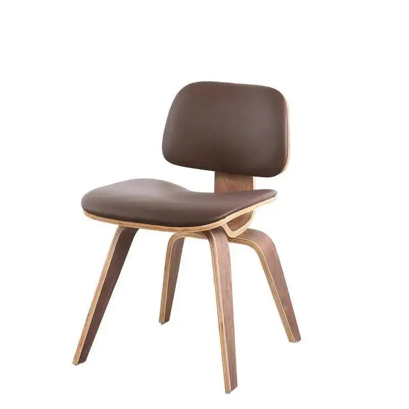 Fontaine Collection | Curved Molded Plywood Dining Chair - captured in a curated lifestyle vignette in a Mid-Century Modern dining room setting.