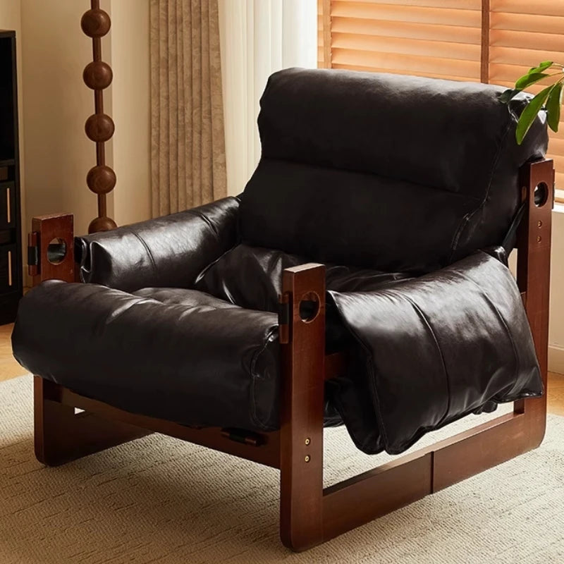 Ellington Collection | Glass-Topped Atomic-Era Cognac Leather Lounge - presented at scale within a designed interior in a Mid-Century Modern living room setting.