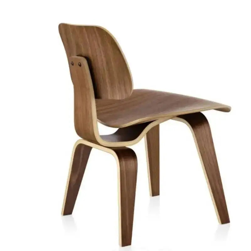 Fontaine Collection | Curved Molded Plywood Dining Chair - styled from an alternate angle revealing dimensional depth in a Mid-Century Modern dining room setting.