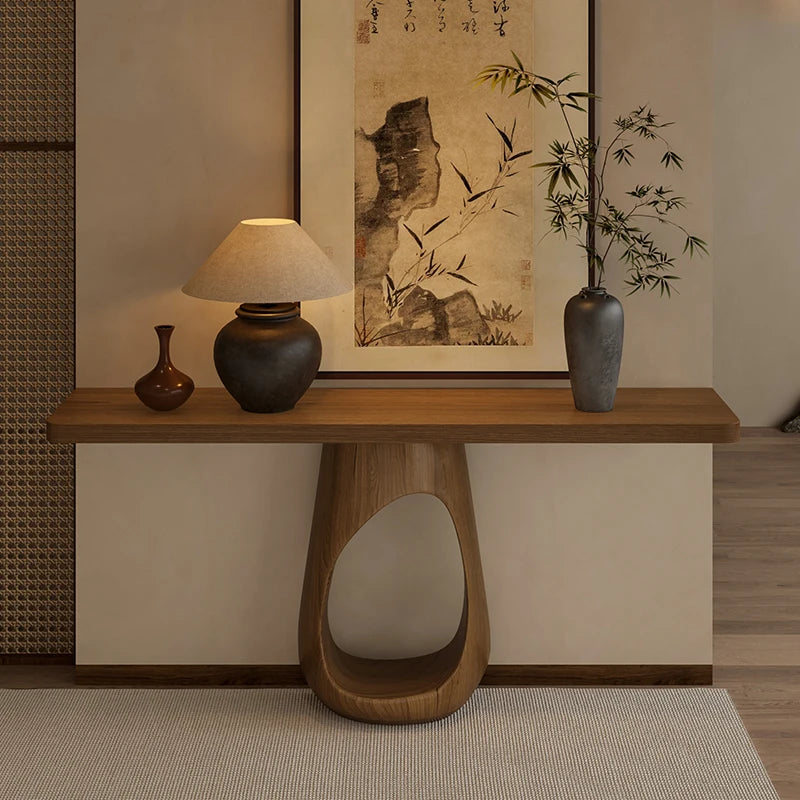 Valencia Collection | Architectural Walnut Console Table - exhibiting shadow play and geometric silhouette detail in a Mid-Century Modern entryway setting.