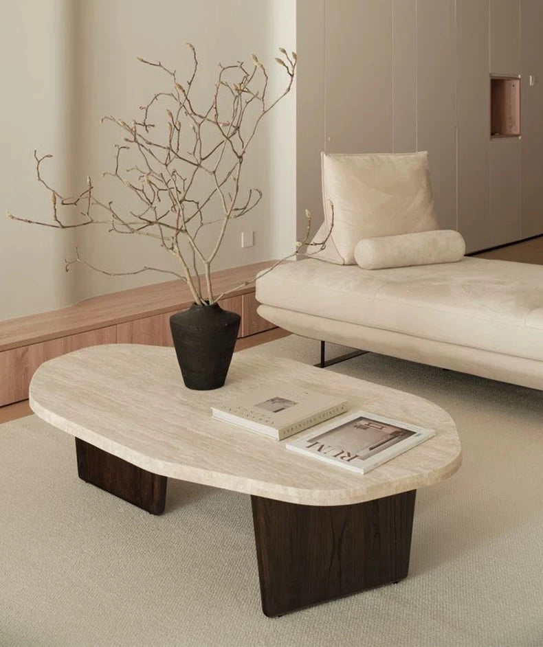 Meridian Collection | Tapered-Leg Oval Walnut Oval Coffee Table - styled from an alternate angle revealing dimensional depth in a Mid-Century Modern living room setting.