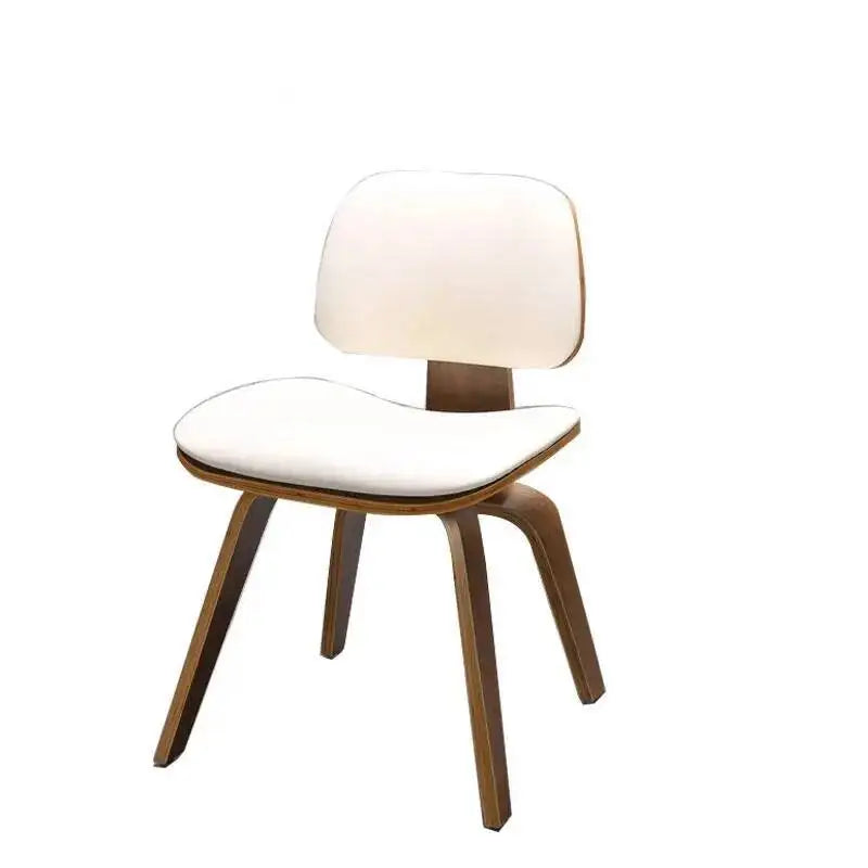 Fontaine Collection | Curved Molded Plywood Dining Chair - presented at scale within a designed interior in a Mid-Century Modern dining room setting.