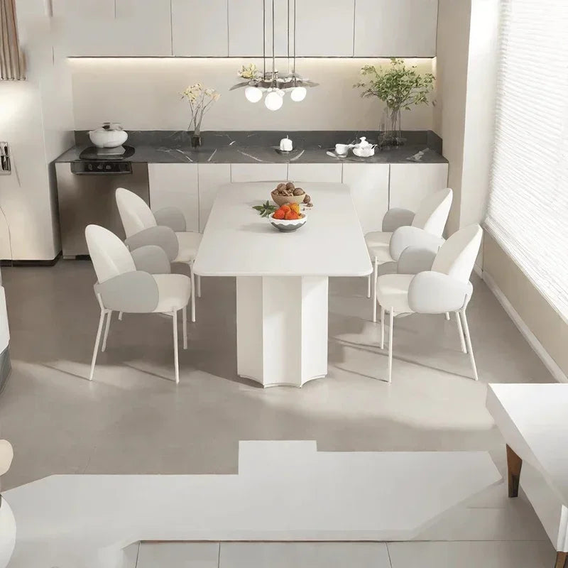 Ellington Collection | Tapered-Leg Curved Walnut Dining Chair - captured in a curated lifestyle vignette in a Mid-Century Modern dining room setting.