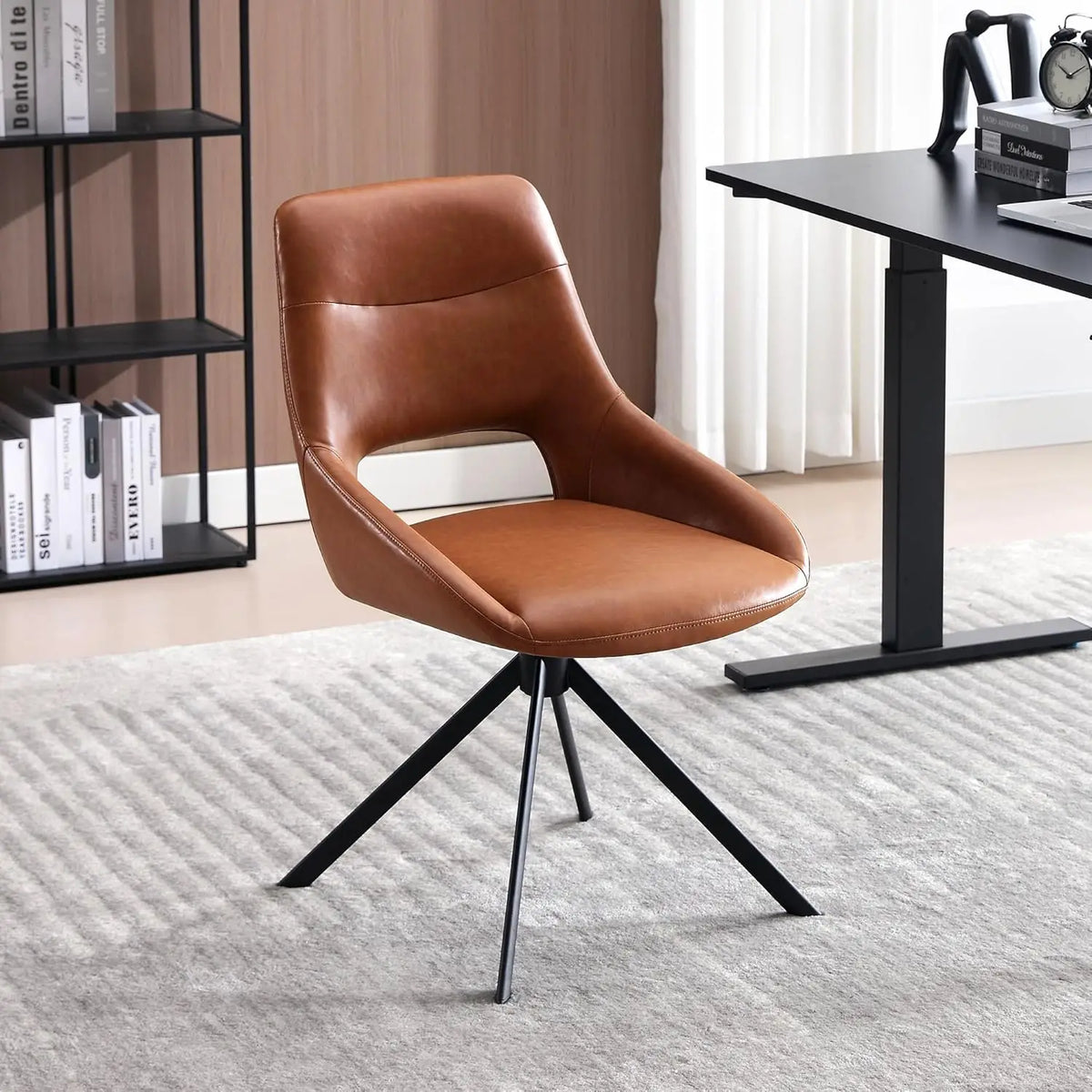 Ellington Collection | Sculptural Leather-Wrapped Swivel in Cognac Faux Leather - framed in an editorial still-life composition in a Mid-Century Modern living room setting.