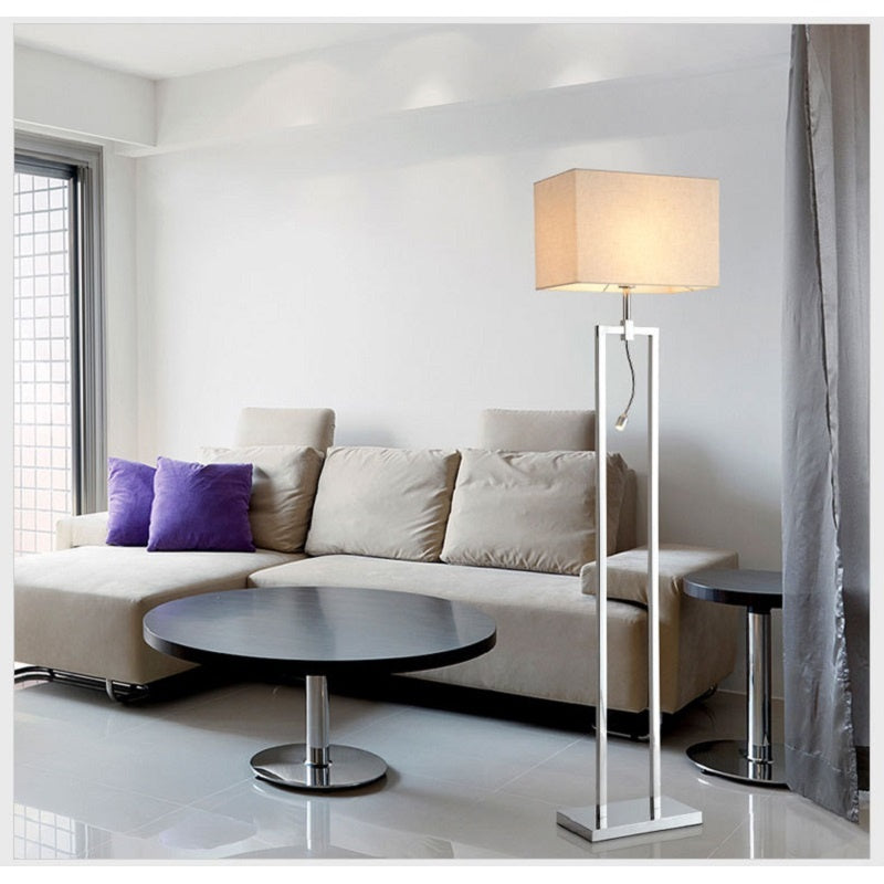 Fontaine Collection | Sculptural Gold-Trimmed Brushed Steel Floor Lamp - showcasing full sculptural form and curated finish in a Mid-Century Modern living room setting.