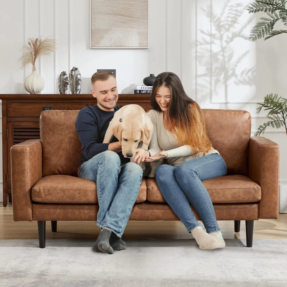 Ellington Collection | Tapered-Leg Leather-Wrapped Vegan Leather Loveseat - captured in a curated lifestyle vignette in a Mid-Century Modern living room setting.