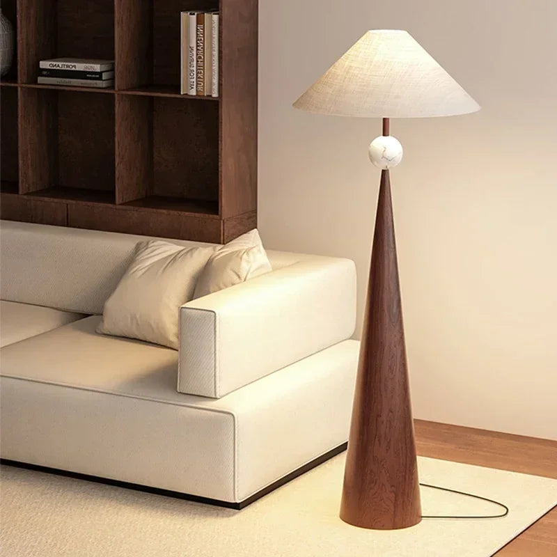 Dresden Collection | Sculptural Atomic-Era Walnut Floor Lamp - revealing tonal warmth and surface patina under ambient light in a Mid-Century Modern living room setting.
