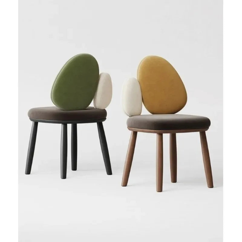 Ellington Collection | Round Atomic-Era Solid Walnut Dining Chairs - captured in a curated lifestyle vignette in a Mid-Century Modern dining room setting.