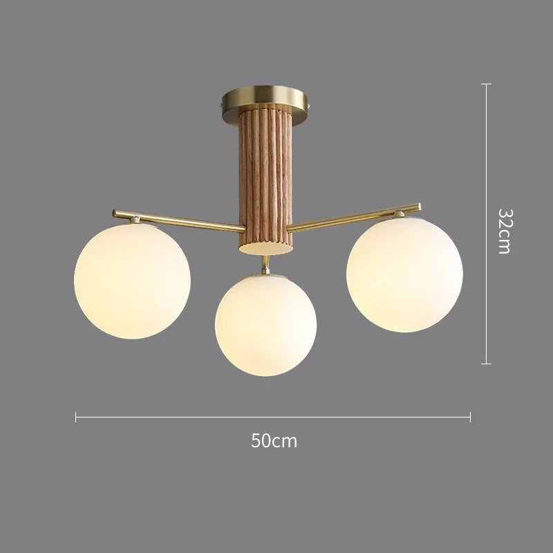 Fontaine Collection | Geometric Stone-Top Rose Quartz Chandelier - featuring close-up joinery and artisanal finish quality in a Mid-Century Modern living room setting.
