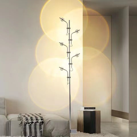 Dresden Collection | Sculptural Steel-Framed Brushed Steel Shadow Lamp - styled from an alternate angle revealing dimensional depth in a Mid-Century Modern living room setting.