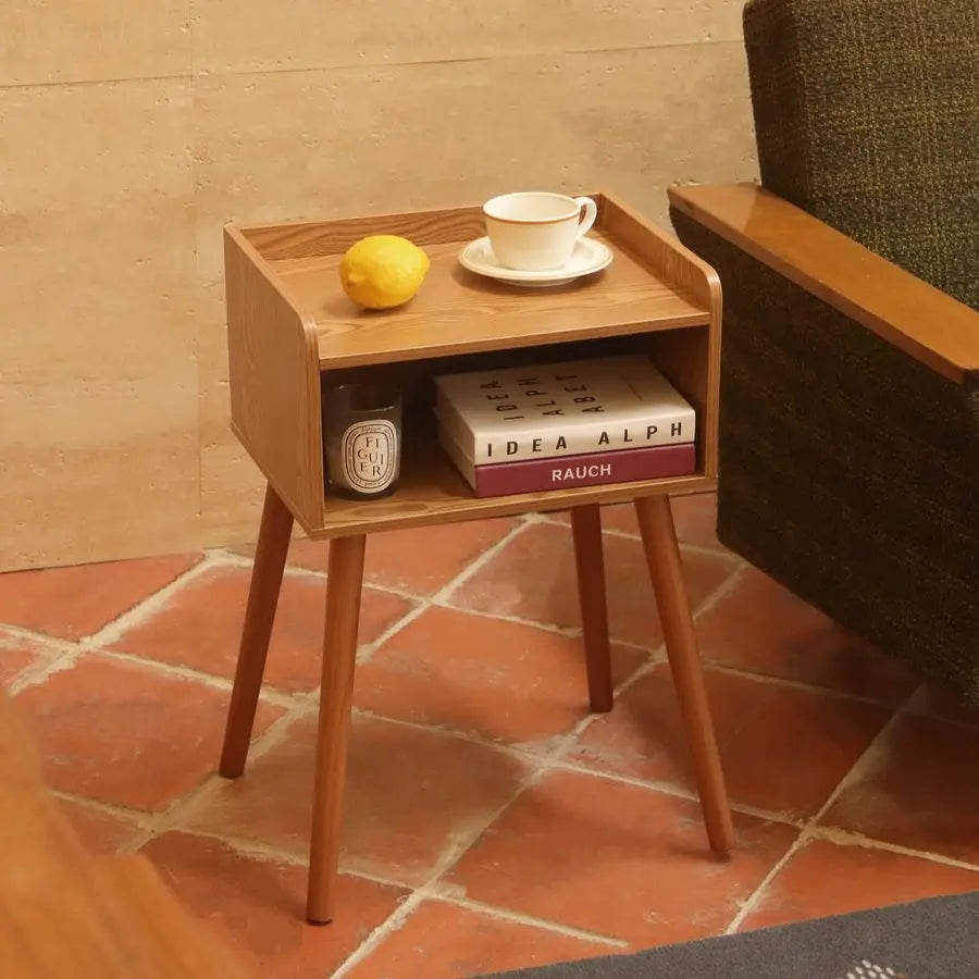 Fontaine Collection | Tapered-Leg Brass-Accented Walnut Nightstand - captured in a curated lifestyle vignette in a Mid-Century Modern bedroom setting.