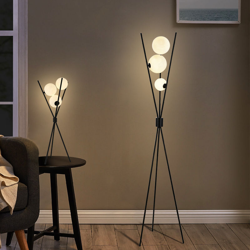 Ellington Collection | Geometric Atomic-Era Tri-Orb LED Floor Lamp - captured in a curated lifestyle vignette in a Mid-Century Modern living room setting.