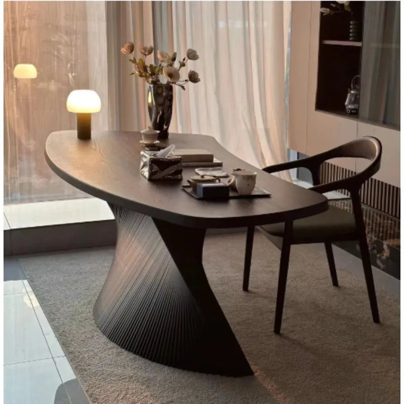 Astoria Collection | Tapered-Leg Oval Walnut Oval Coffee Table - revealing tonal warmth and surface patina under ambient light in a Mid-Century Modern living room setting.