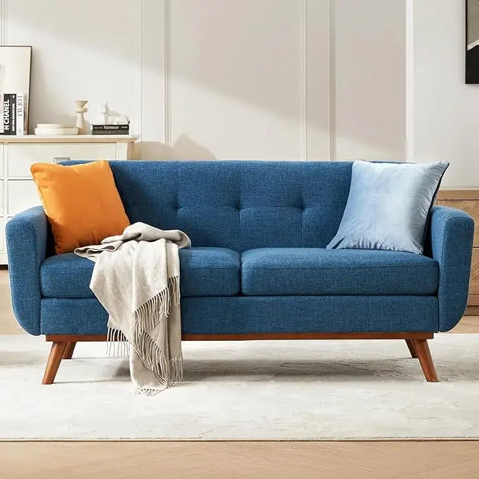 Fontaine Collection | Tapered-Leg Curved Walnut & Bouclé Loveseat - revealing tonal warmth and surface patina under ambient light in a Mid-Century Modern living room setting.