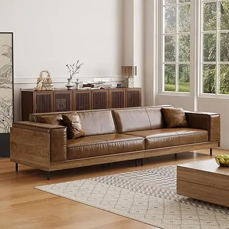 Ellington Collection | Floating Leather-Wrapped Full-Grain Leather & Walnut Lounge Chair - framed in an editorial still-life composition in a Mid-Century Modern living room setting.
