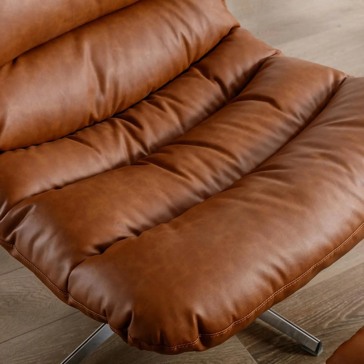 Ellington Collection | Floating Leather-Wrapped Walnut Swivel Chair and Ottoman - highlighting material texture and craftsmanship detail in a Mid-Century Modern living room setting.