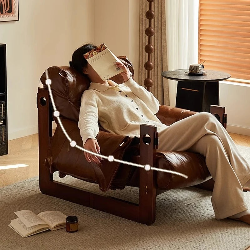 Ellington Collection | Glass-Topped Atomic-Era Cognac Leather Lounge - exhibiting shadow play and geometric silhouette detail in a Mid-Century Modern living room setting.