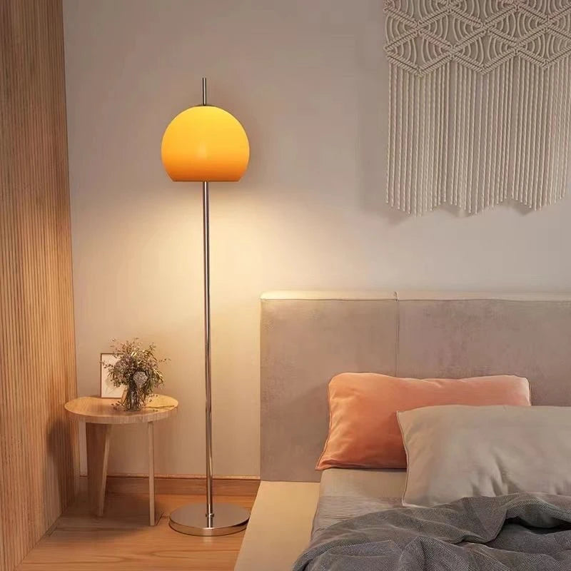 Fontaine Collection | Sculptural Glass-Topped Frosted Glass Floor Lamp - revealing tonal warmth and surface patina under ambient light in a Mid-Century Modern living room setting.