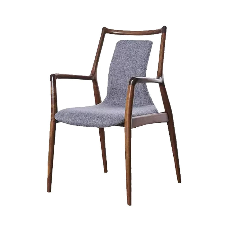 Ellington Collection | Floating Brass-Accented Walnut Armchair - revealing tonal warmth and surface patina under ambient light in a Mid-Century Modern living room setting.