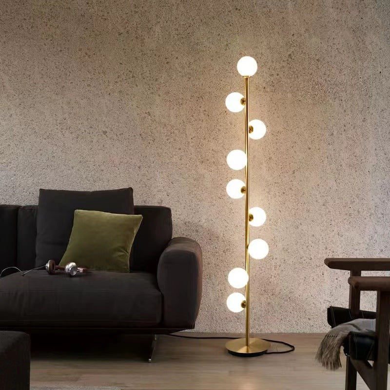 Astoria Collection | Geometric Brass-Accented Walnut & Brass Floor Lamp - highlighting material texture and craftsmanship detail in a Mid-Century Modern living room setting.