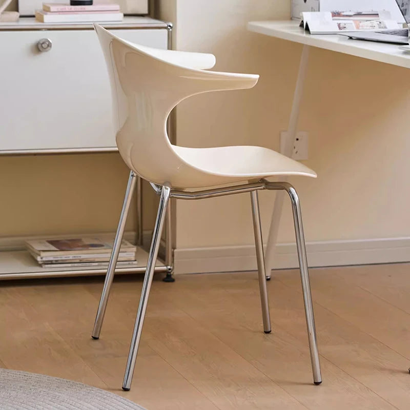 Dresden Collection | Sculptural Atomic-Era Walnut Dining Chairs - presented at scale within a designed interior in a Mid-Century Modern dining room setting.